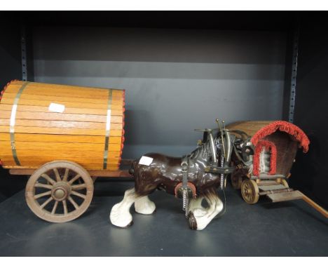 A ceramic shire horse with two wooden gypsy carts