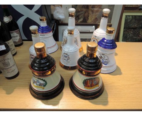 Eight Wade whisky bells including Christmas 1990 and 1991, unopened