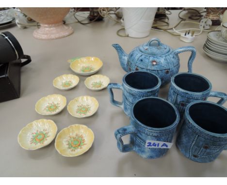 A selection of Carlton ware pin dishes and studio pottery teapot and cups in denim design
