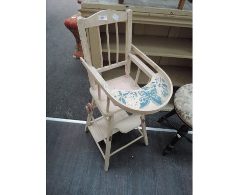 A vintage collectable painted high chair suitable for doll use only
