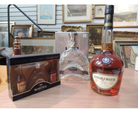 A bottle of Courvoisier VS cognac, A Martel miniature boxed set and a empty Martel decanter