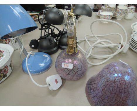 A glass table lamp and three angle poised lamps