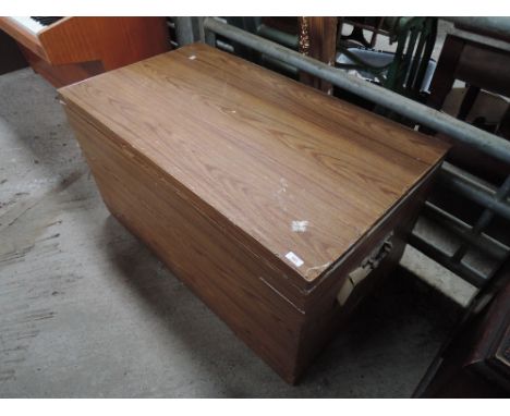 A vintage pine and metal frame blanket box