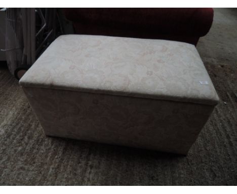 A vintage wooden blanket box with later covering
