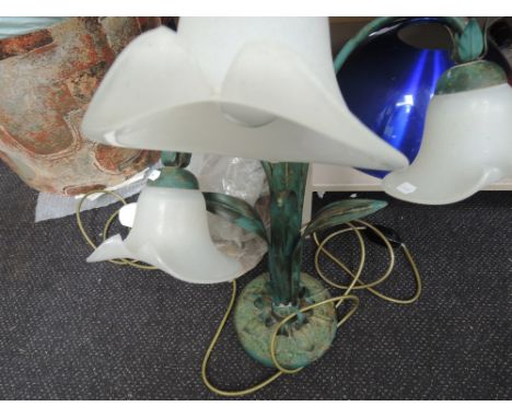 A tri-light table lamp styled as a flower