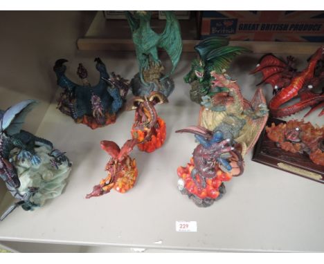 A shelf of dragon figurines