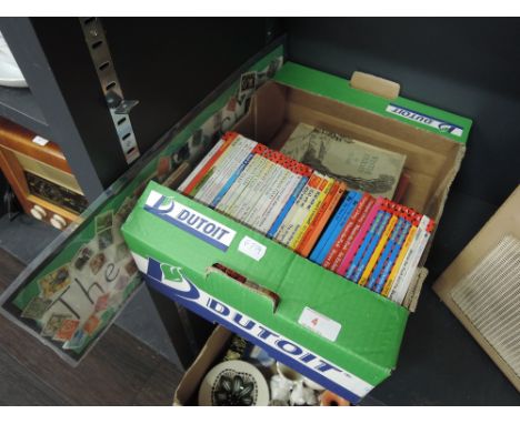 A selection of modern Ladybird childrens books, vintage books and decorative stamps