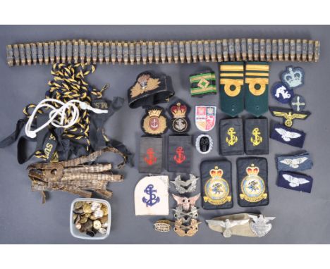 A collection of assorted military and Royal Navy uniform patches and accessories to include a bandolier, epaulettes, captalli
