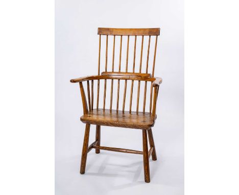 PRIMITIVE WELSH ELM & ASH COMB BACK CHAIR, 19th Century, nine-stick back, carved arms, bowed supports, shaped seat, turned le