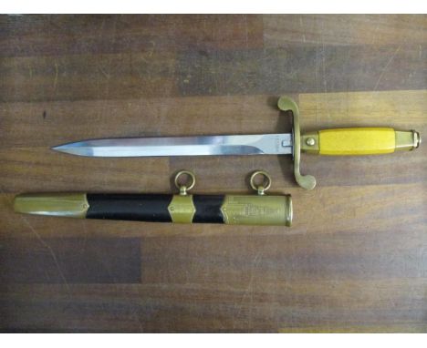 A Soviet Russian military parade dagger and scabbard, stamped number and marks to top of blade 