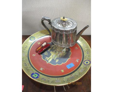 A Carltonware charger decorated with an Oriental landscape, a cheroot holder and a silver plated teapot 