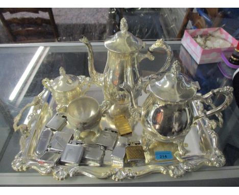 A silver plated four piece tea set on tray with trim handles and a group of Ronson, Veriflame, Polo, Zippo and other lighters