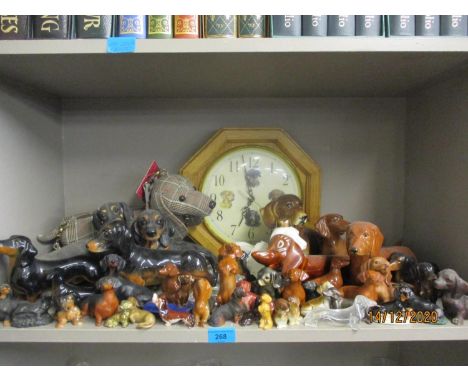 A quantity of mixed composition, china and glass models of dachshunds  to include Beswick, Wade, Sylvac and Midwinter Ltd exa