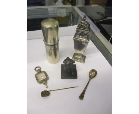 Silver to include a pepper pot and a canister along with a modern bronze seal, a gold coloured pin with a black rock containi