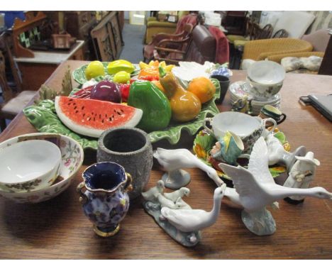 A selection of ceramics to include Barbados fruits, Royal Worcester candle snuffer in the form of a nun, Lladro geese and oth