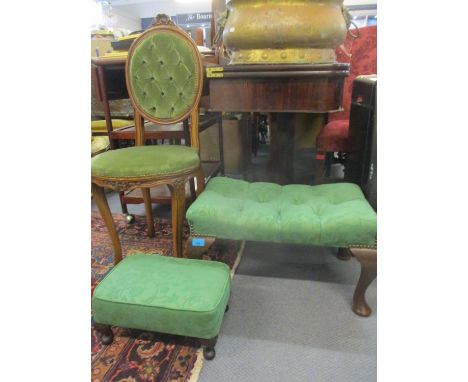 A reproduction French style salon chair with button back and two footstools with cabriole legs, all in a green coloured fabri