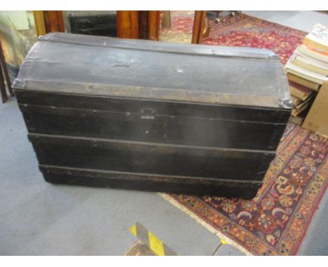 A Victorian black canvas bound twin handled trunk 