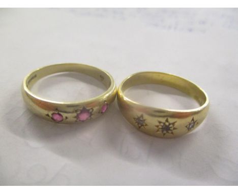 A 9ct gold gypsy style ring inset with three small rubies together with a yellow metal gypsy style ring inset with three diam