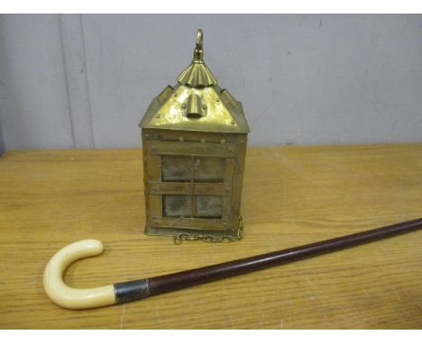 A brass arts and crafts style lantern, an ivory handled walking stick with an exotic hardwood shaft, and a Persian rug A/F 