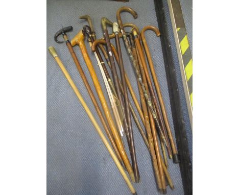 Mixed walking sticks to include one with an antler handle, taxidermy horn handled stick and others 