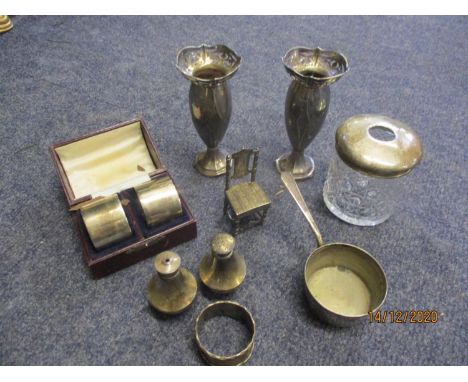 A small quantity of silver and white metal to include a pair of silver spill vases (109.8g) and a miniature white metal model