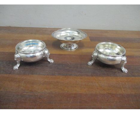 A pair of Georgian silver salts, marks rubbed, and a small footed trifoil shaped dish 