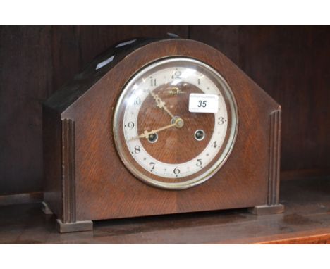 A Bentima oak mantel clock