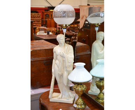 A composition figural table lamp as a Roman Emperor; a brass oil lamp