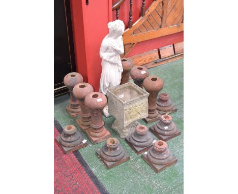 Six terracotta balustrades; a moulded planter and a moulded figure of a woman.