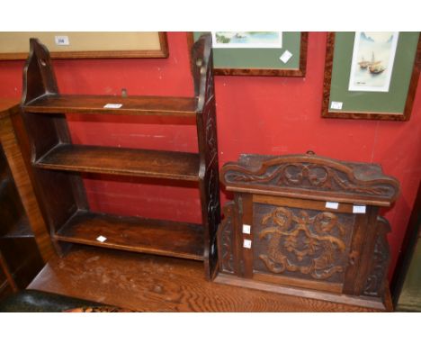 A small oak wall cabinet, fretwork door and apron; a three shelf oak wall shelving unit (2) 