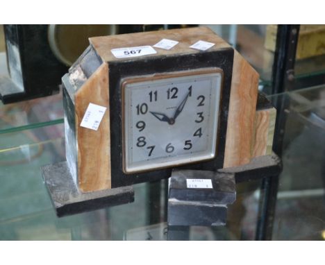 An Art Deco marble mantel clock, eight day movement