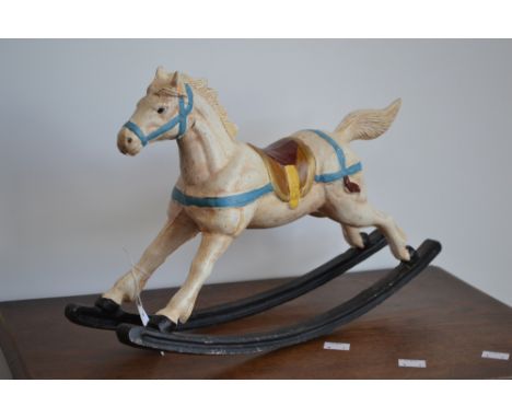 A miniature cast iron rocking horse, 26cm high