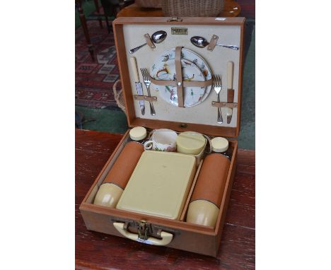 A Brexton two person ceramic picnic hamper, decorated with stylized landscape and flowers; flasks; etc  