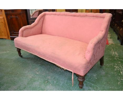 A Victorian two seat bedroom sofa, buttoned top rail and arms, padded back and seat, turned forelegs, ceramic casters