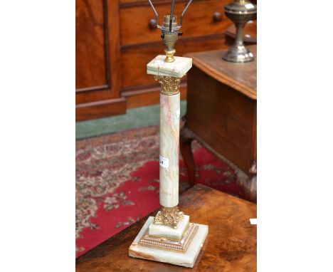 A table lamp with onyx and gilt metal mounted column.