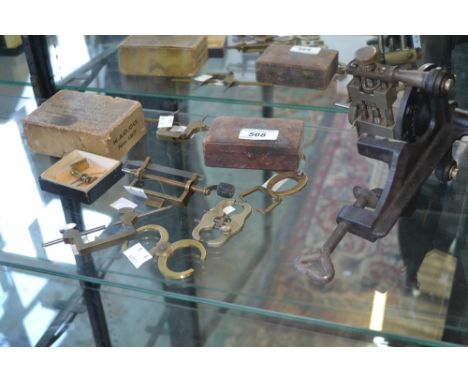 Horology - A K & D Co. main spring winder No.127; another; a Star balance wheel poising tool; another two, one with "run-out"