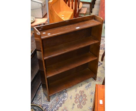 A floor standing bookcase; a wall mounted oak book shelf (2)