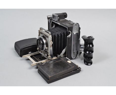 A Graflex Crown Graphic Camera, serial no 714414, body G, bellows G-VG, with Rodenstock Heligon 80mm f/2.8 lens, serial no 61