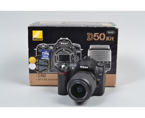 A Nikon D50 DSLR Camera, serial no 6289448, body G-VG, slight tackiness to grip, powers up, takes a picture, otherwise untest