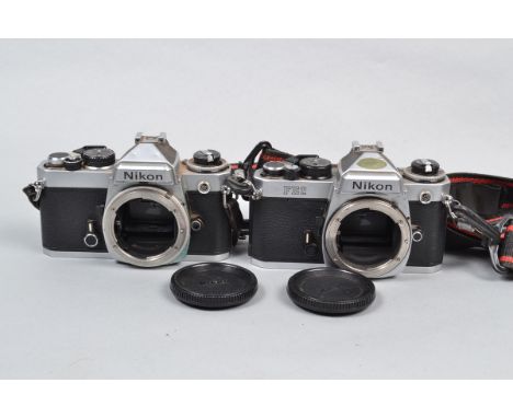 A Nikon FE2 and a Nikon FE SLR Bodies, FE2 serial no 2408954, body F, top plate dirt, shutter working, meter reacts to light,