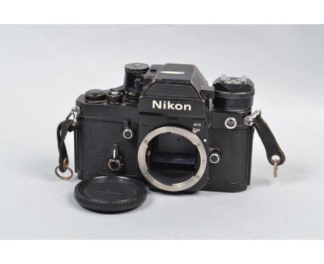 A Nikon F2AS Photomic SLR Body, black, serial no 7703144, body F, wear and brassing, shutter working, with DP-12 prism viewfi