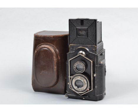 A Zeiss Ikon Ikoflex Coffee Can TLR Camera, 850/16, serial no on film cartridge Y89491, shutter slightly sluggish on slow spe