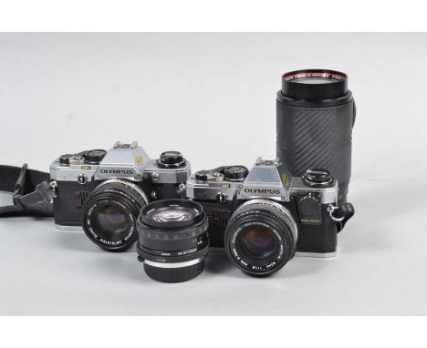 Two Olympus OM10 SLR Cameras, serial no 2743960 body G, shutter working with Manual Adapter, serial no 1 565 215, body F, shu