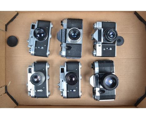 A Tray Eastern Bloc Cameras, a Zorki 4, two Zorki 4-K, with Jupiter-8 50mm f/2 lenses, a Moshva-80 Zenit E, with Industar 50m