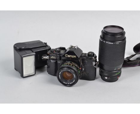 A Canon A-1 SLR Camera Outfit, serial no 812730, body F-G, shutter working with "squeak", meter reacts to light, viewfinder d