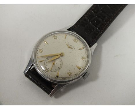 A VINTAGE GENTS LONGINES WRISTWATCH ON LEATHER STRAP