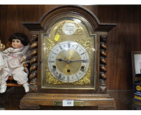 AN OAK CASED BARLEY TWIST TEMPUS FUGIT MANTEL CLOCK  