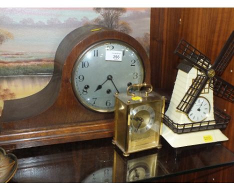 AN OAK NAPOLEON MANTEL CLOCK TOGETHER WITH A MUSICAL WINDMILL CLOCK AND A CARRIAGE CLOCK (3)