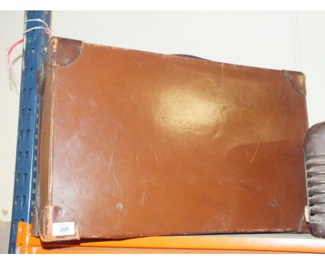 A VINTAGE LEATHER SUITCASE 