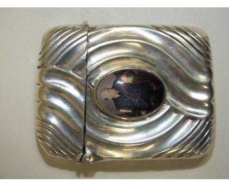 A SILVER CASED ART NOUVEAU STYLE CIGARETTE LIGHTER WITH INSET PORTRAIT